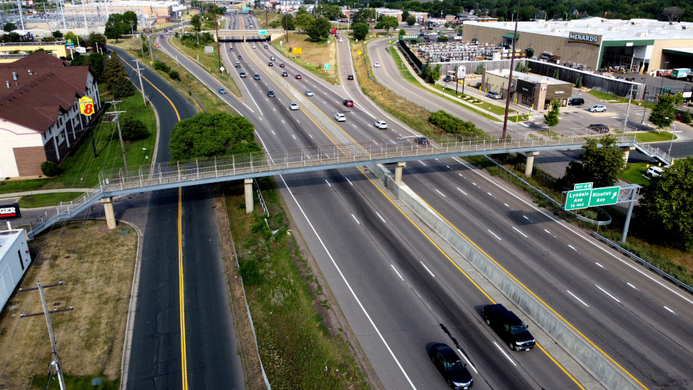 Aerial photo of the Bloomfield Bridge #9078 over I-494 looking west toward Nicollet Ave with Menards and Super 8 in the background.